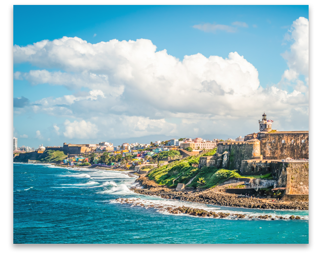 Need translation - Colorful image with fortification Castillo San Felipe del Morro along the coastline in San Juan, Puerto Rico. Blue sky and white clouds.